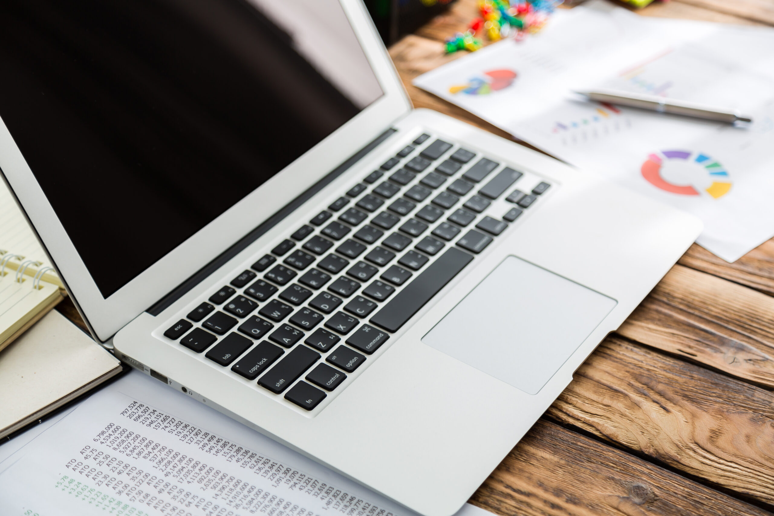 Home financial charts on the table with laptop